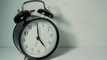 The alarm clock on a white background, in the style of time-lapse . video