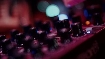 Sound engineer mixing music on analog mixing desk video