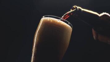 Pouring a frothy drink in a dimly lit bar creating a vibrant atmosphere during evening relaxation video
