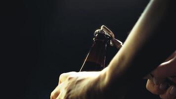 Capturing the art of opening a refreshing beverage in a dimly lit setting during a gathering video