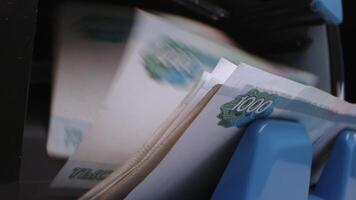 A close-up view of money being counted by a machine video
