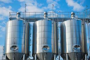 Industrial Stainless Steel Silos for Bulk Storage and Manufacturing Processes photo