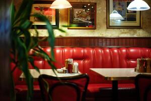 Stylish Restaurant Booth Interior with a Trendy and Relaxing Atmosphere, Perfect for an Enjoyable Dining Experience photo