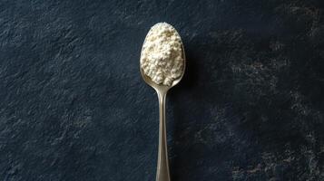 A spoonful of BCAA beta-glucan anabolic whey protein powder. photo
