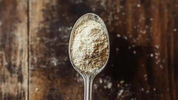 A spoonful of BCAA beta-glucan anabolic whey protein powder. photo