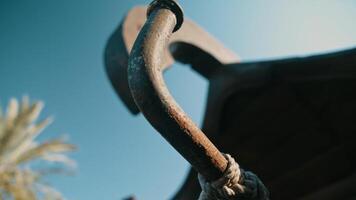 A rusty metal pipe with a small object on it photo