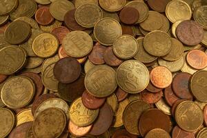 Close-up of a stack of Euro coins, showcasing detailed textures and shining surfaces. Ideal for financial and currency-related content. photo