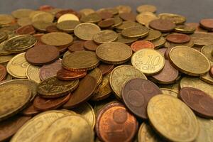 Close-up of a stack of Euro coins, showcasing detailed textures and shining surfaces. Ideal for financial and currency-related content. photo