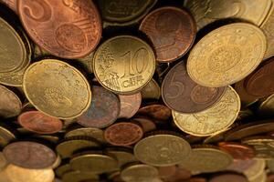 Close-up of a stack of Euro coins, showcasing detailed textures and shining surfaces. Ideal for financial and currency-related content. photo