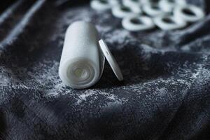 white eyelets and grommet tape on a curtain, top view, installing eyelets in curtain photo