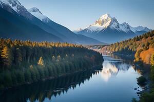Breathtaking mountain peaks covered in snow, green valleys, and a crystal-clear river winding through a majestic landscape photo