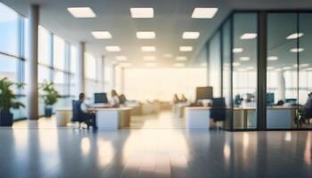 blurred open office space with large floor-to-ceiling windows, allowing plenty of natural light to flood the room. The soft focus creates a serene and modern ambiance, making it ideal for business photo