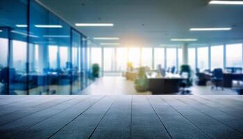 blurred open office space with large floor-to-ceiling windows, allowing plenty of natural light to flood the room. The soft focus creates a serene and modern ambiance, making it ideal for business photo