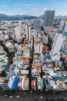 Aerial view top of the skyscrapers in center of Nha Trang city in Asia at summer day. Nha Trang, Vietnam - July 19, 2024 photo