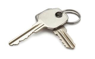 Two silver keys on a keyring isolated on a white background. photo