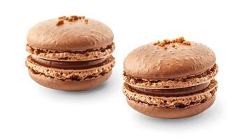 Two chocolate macarons with caramel filling and chocolate sprinkles on top. photo