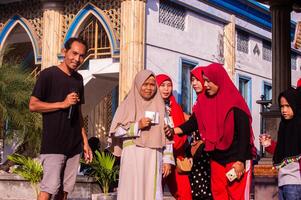 Gresik, Indonesia, 20 August 2023 - Village residents who were gathering at an event in the community area. photo