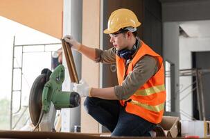 Engineer in Safety Gear Working on Construction Site with Tools and Equipment, Focused on Measurements and Precision photo