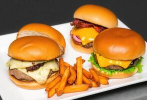 Gourmet Burger Trio with Sweet Potato Fries photo