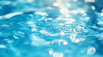 Rippled Blue Water. Shining Surface with Splashes and Bubbles photo