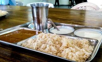 A platter of Indian red Kidney beans curry or Rajma Masala and rice photo