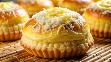A close up photograph of a Filipino style ensaymada a sweet bread topped with margarine and white sugar captured with a fisheye lens, sweet, dessert, style, margarine, delicious photo