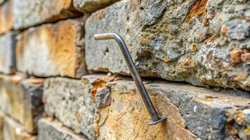 stone, fix, reinforcement,metal, staple, infrastructure, architecture, craftsmanship, wall, construction materials, renovation, Metal staple used to repair a crack in a stone wall photo
