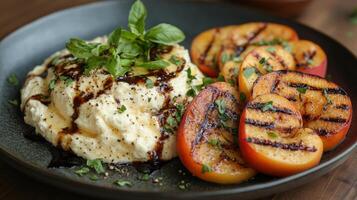Creamy dish with grilled peaches and balsamic drizzle. photo