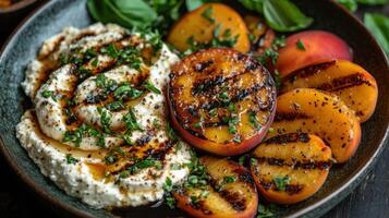 Grilled peaches with goat cheese and herbs photo