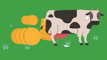 A cow is standing next to a pile of hay vector