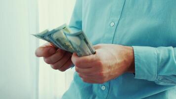 Counting cash and making transactions in a modern setting during the day video