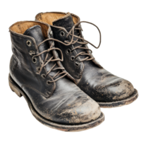 Worn black boots with mud, showcasing signs of use, cut out transparent png