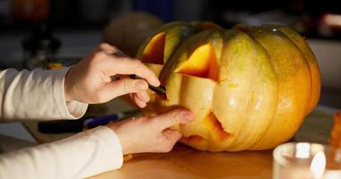 Hands Carving Halloween Pumpkin Jack-o'-Lantern video
