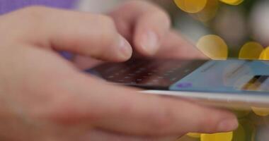 Close-up of hands typing on a smartphone with a virtual keyboard video