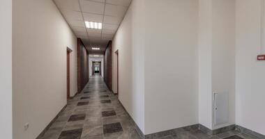 loop seamless rotation in white empty long corridor and room with window in interior of modern apartments or office video