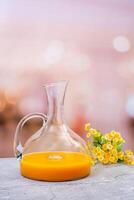 Fresh glass of Orange Juice in Elegant Decanter photo