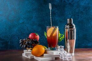 A setup of multi Fruit Cocktail with Shaker and Ice Cubes photo