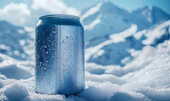 Blank aluminum can in snowdrift, cold winter background with copy space photo
