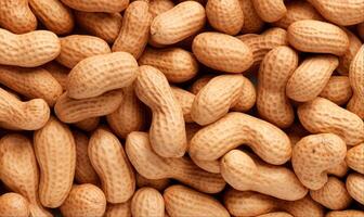 Unpeeled peanuts background, top view, close up texture photo