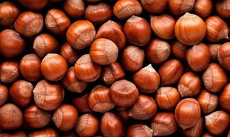 Hazelnuts background, top view, close up of hazelnut nuts texture photo
