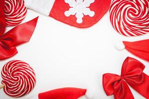 Flatlay of some red Christmas decoration, on a white background. Background for Christmas. photo