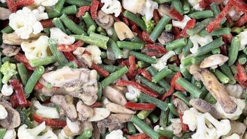 Selling frozen vegetables in the fridge of a grocery store. photo