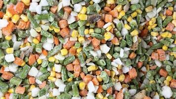 Selling frozen vegetables in the fridge of a grocery store. photo