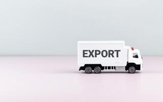 White toy truck on blocks with the text EXPORT. photo