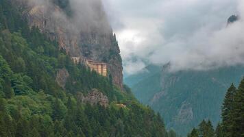 Time lapse view of Sumela Monastery in Trabzon with motion of the clouds or fog. Visit Trabzon or Visit Turkey concept background 4k timelapse . video