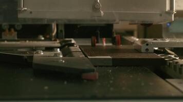 Close-up of automated drilling machine on wood. Creative. Automated machine for production of wood products processing. Drilling machine for holes in wooden boards video