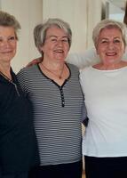 A vibrant community of senior women, guided by their instructor, embraces the enriching journey of yoga, fostering unity, well-being, and a shared commitment to active aging photo