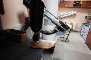 Prosthetic leg manufacturing in a workshop setting photo