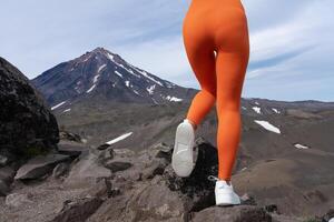 Closeup woman in figure hugging sports leggings showing off buttocks and legs. Lower part of body photo