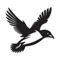A black and white bird flying in the air vector